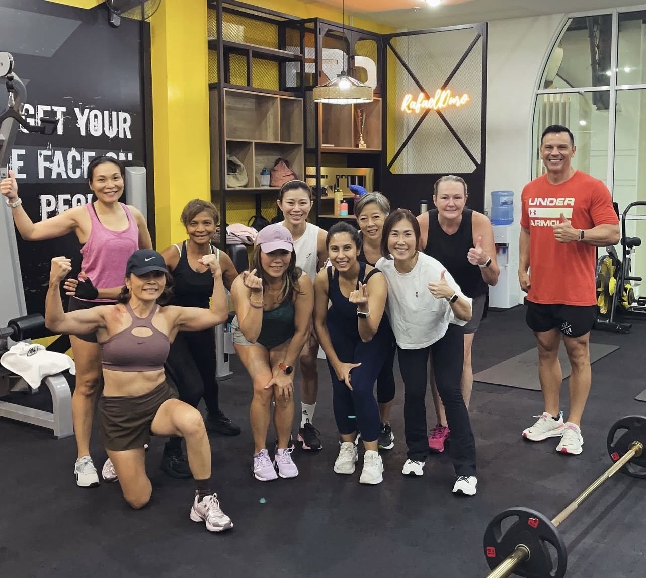 Women's GTS45 group flexing with Rafael at the studio in Straits Quay